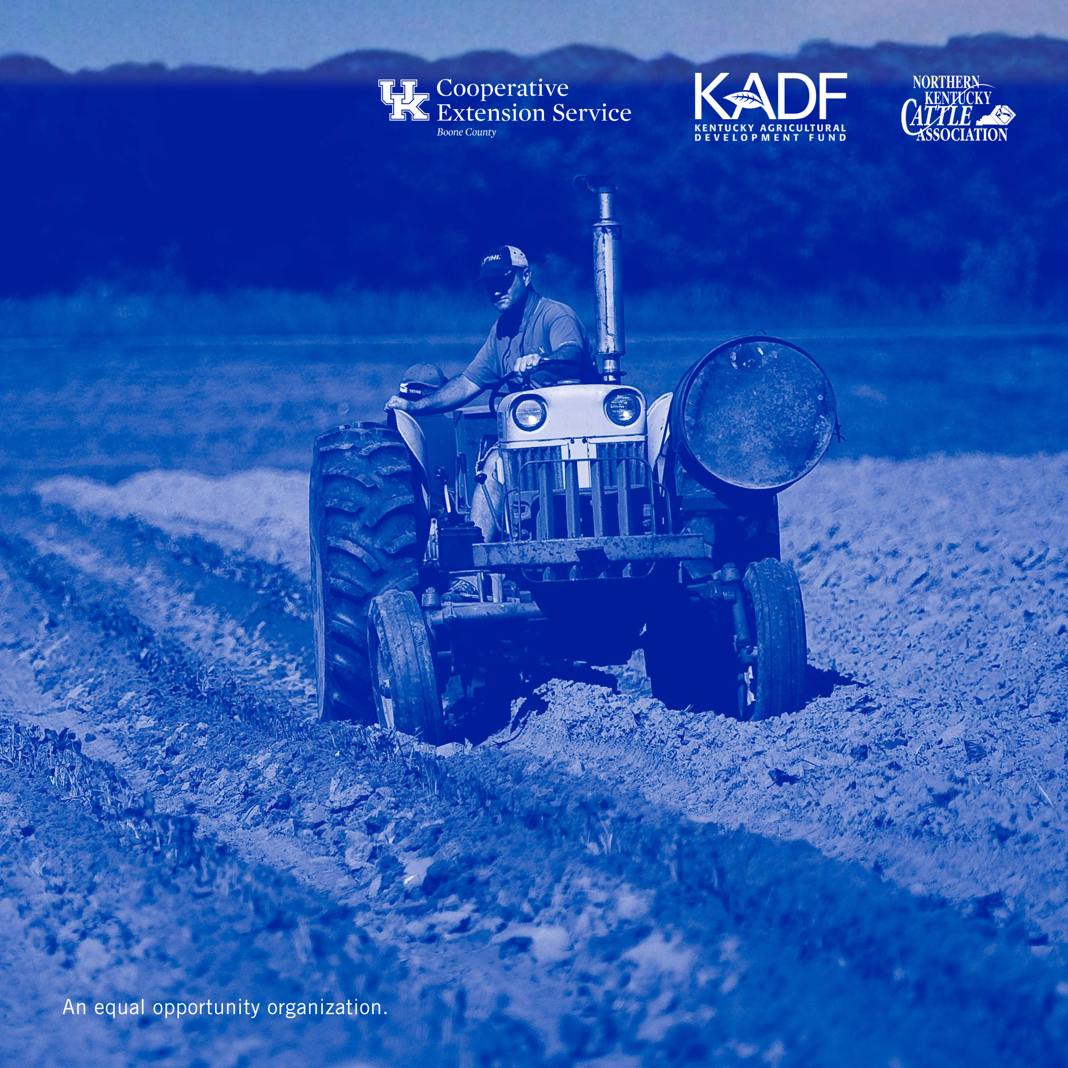 A man on a tractor working his field. 